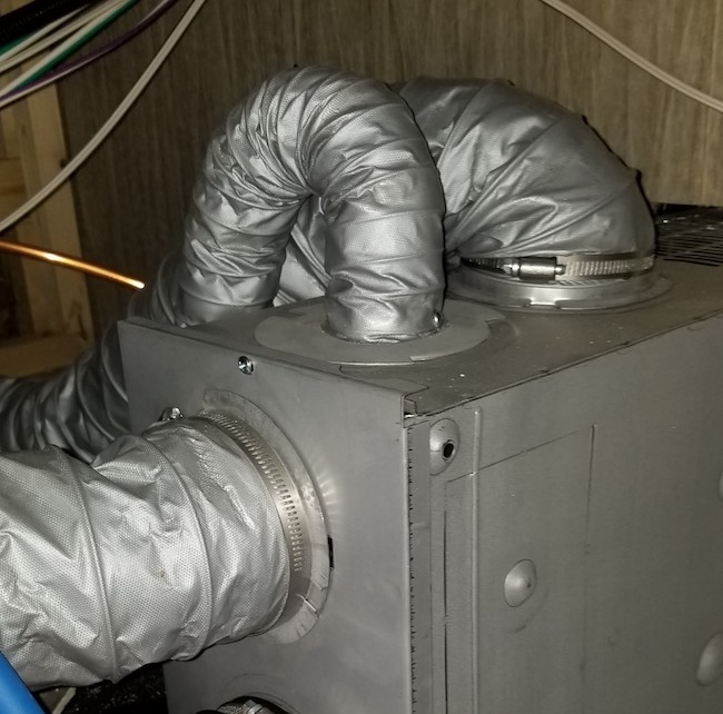 Suburban RV furnace showing restricted ducting. Top outlets are restricted with short radius turns